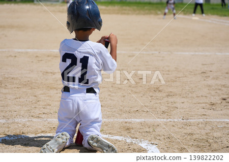 A young baseball player who is working hard to become a professional baseball player A young baseball player who is working hard to become a professional baseball player 139822202