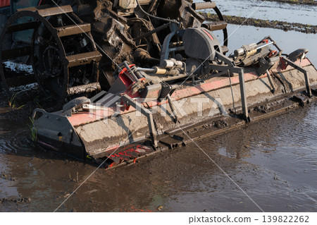 A scene of plowing a rice paddy. A scene of plowing a rice paddy. 139822262