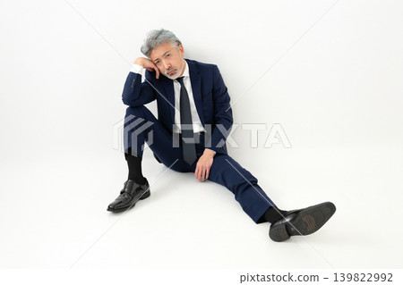 Sitting businessman Sitting businessman 139822992