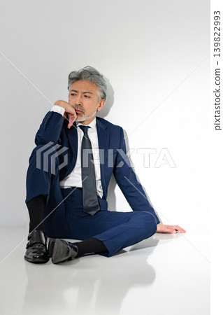 Sitting businessman Sitting businessman 139822993