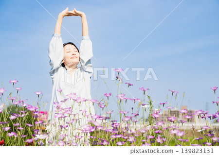 Young woman stretching outdoors Lifestyle image 139823131