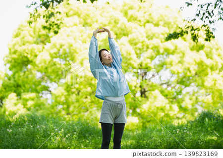 Young woman stretching, sports image Young woman stretching, sports image 139823169