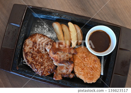 A delicious-looking grilled hamburger lunch. A delicious-looking grilled hamburger lunch. 139823517