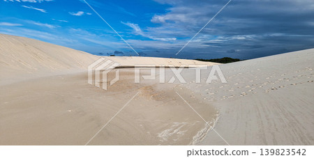 Dunes and lagoons of lagoa bonita, Lencois Maranhenses, Barreirinhas, Brazil. White sand dunes with pools of fresh water Dunes and lagoons of lagoa bonita, Lencois Maranhenses, Barreirinhas, Brazil. White sand dunes with pools of fresh water 139823542