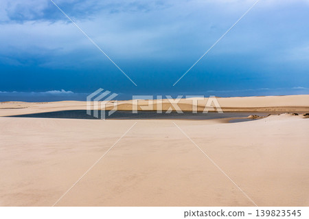 Dunes and lagoons of Atins, Lencois Maranhenses, Barreirinhas, Brazil. White sand dunes with pools of fresh water Dunes and lagoons of Atins, Lencois Maranhenses, Barreirinhas, Brazil. White sand dunes with pools of fresh water 139823545