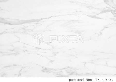 White Marble Surface Featuring Faint Grey Veining Patterns. White Marble Surface Featuring Faint Grey Veining Patterns. 139823839