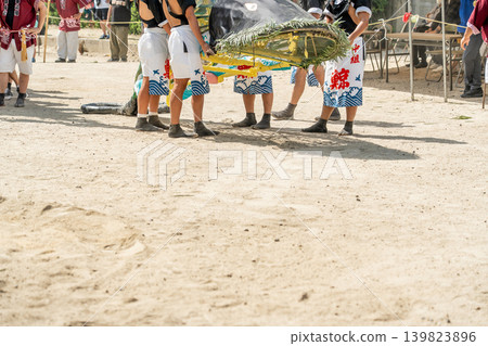 Young people operating the whales on the whale boats during the whale boat festival at Toride Shrine in Yokkaichi City, Mie Prefecture. Young people operating the whales on the whale boats during the whale boat festival at Toride Shrine in Yokkaichi City, Mie Prefecture. 139823896