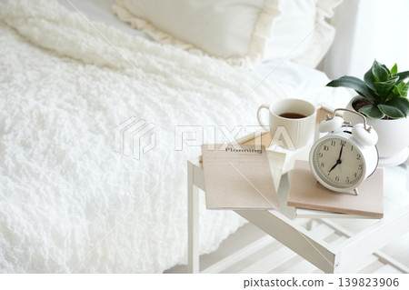 Bedside table and alarm clock Bedside table and alarm clock 139823906