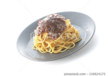 Spaghetti with meat sauce photographed alone against a white background. Spaghetti with meat sauce photographed alone against a white background. 139824173