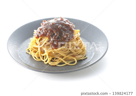 Spaghetti with meat sauce photographed alone against a white background. Spaghetti with meat sauce photographed alone against a white background. 139824177