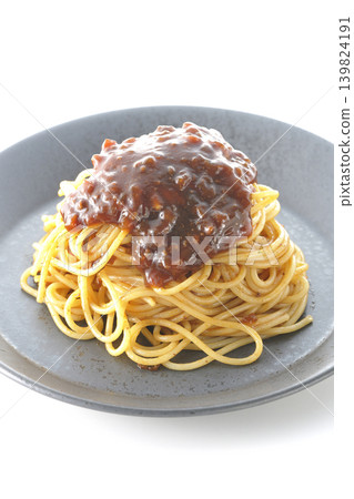 Spaghetti with meat sauce photographed alone against a white background. Spaghetti with meat sauce photographed alone against a white background. 139824191