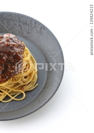 Spaghetti with meat sauce photographed alone against a white background. Spaghetti with meat sauce photographed alone against a white background. 139824215