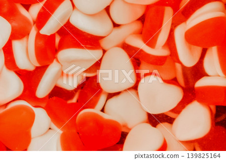 Gummies jelly sweet sugar marmalade white food candy red color background Gummies jelly sweet sugar marmalade white food candy red color background 139825164