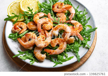 Grilled shrimps prawns and arugula salad, healthy eating Grilled shrimps prawns and arugula salad, healthy eating 139825761
