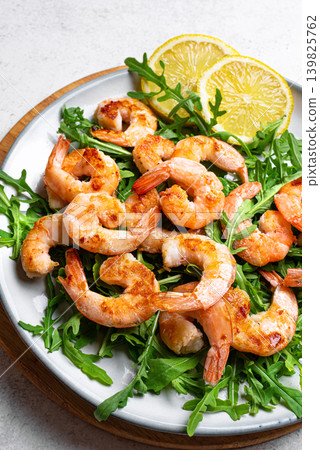 Grilled shrimps prawns and arugula salad, healthy eating Grilled shrimps prawns and arugula salad, healthy eating 139825762