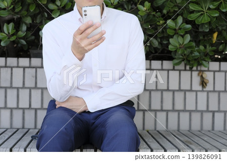 A man operating an app A man operating an app 139826091