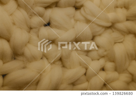 Many cotton wads, white in color, are stacked close, filling space Many cotton wads, white in color, are stacked close, filling space 139826680
