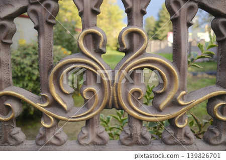Gilded fence divides property from world Gilded fence divides property from world 139826701