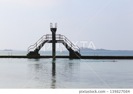 The seawater swimming-pool with a diving board in Saint-Malo, France The seawater swimming-pool with a diving board in Saint-Malo, France 139827084