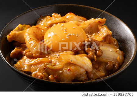 Pork, kimchi, and natto rice bowl (topped with egg yolk) Pork, kimchi, and natto rice bowl (topped with egg yolk) 139827705