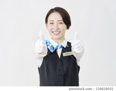 Female staff member, receptionist/bus guide, good sign, white background Female staff member, receptionist/bus guide, good sign, white background 139828035