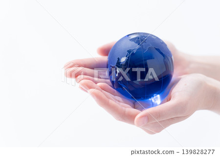 A woman with a globe hand A woman with a globe hand 139828277
