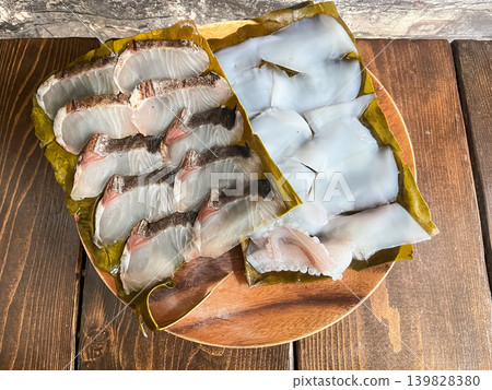 Spanish mackerel and bigfin reef squid cured in kelp. A dish in which fresh sashimi is wrapped in kelp and aged. Spanish mackerel and bigfin reef squid cured in kelp. A dish in which fresh sashimi is wrapped in kelp and aged. 139828380