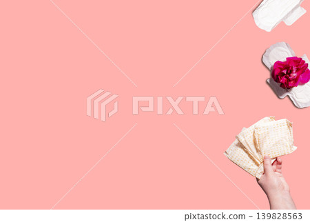 Flat lay of female critical day and hygiene accessories. Conceptual image of menstruation and woman health topics Flat lay of female critical day and hygiene accessories. Conceptual image of menstruation and woman health topics 139828563