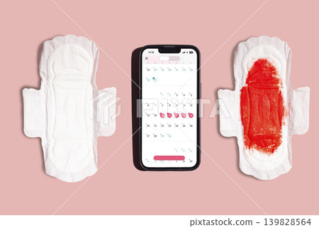 Smartphone with woman menstrual period calendar on pink background. Modern technologies for women Smartphone with woman menstrual period calendar on pink background. Modern technologies for women 139828564
