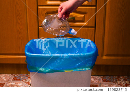 Woman putting used plastic bottle in waste bin, separate waste collection and recycling concept. High quality photo Woman putting used plastic bottle in waste bin, separate waste collection and recycling concept. High quality photo 139828743