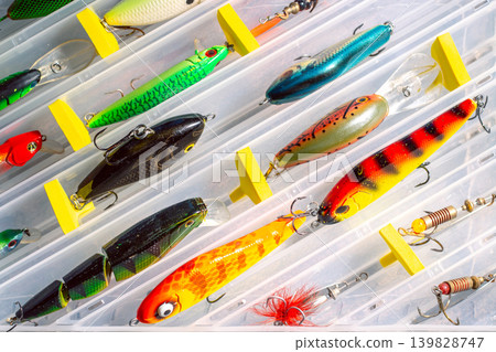 Fishing Tackle Box Organized with Various Lures. Fishing equipment and accessories Fishing Tackle Box Organized with Various Lures. Fishing equipment and accessories 139828747