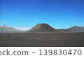 Wide angle view of Mount Batok volcano cone in the center of black sand desert at Bromo Tengger Semeru Indonesia 139830470
