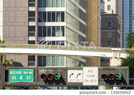 Traffic lights regulating driving cars on city street in Miami, Florida Traffic lights regulating driving cars on city street in Miami, Florida 139830602
