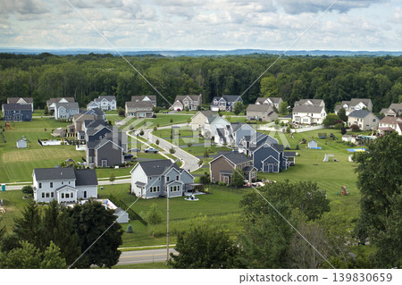 Aerial view of large private homes in Rochester, NY residential area. New family houses as example of real estate development in american suburbs Aerial view of large private homes in Rochester, NY residential area. New family houses as example of real estate development in american suburbs 139830659