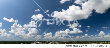 Blue sky with white summer rain clouds. Colorful summer landscape Blue sky with white summer rain clouds. Colorful summer landscape 139830681