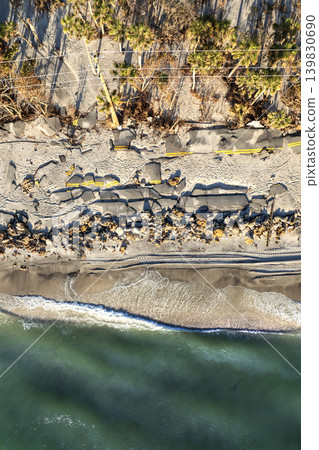 Oceanfront road erosion after hurricane Milton on Manasota Key in Florida. Storm surge destroyed driveway at Blind Pass Beach. Severe damage to traffic infrastructure Oceanfront road erosion after hurricane Milton on Manasota Key in Florida. Storm surge destroyed driveway at Blind Pass Beach. Severe damage to traffic infrastructure 139830690