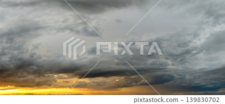 Amazing sunset skyscape. Evening sky with bright colorful orange and yellow clouds Amazing sunset skyscape. Evening sky with bright colorful orange and yellow clouds 139830702