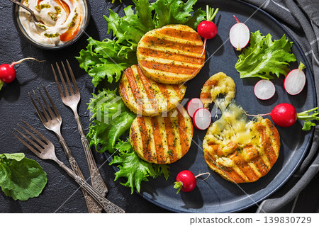 grilled cheese rounds on a plate with radishes grilled cheese rounds on a plate with radishes 139830729