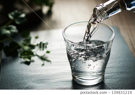Mineral water being poured into a glass Mineral water being poured into a glass 139831219