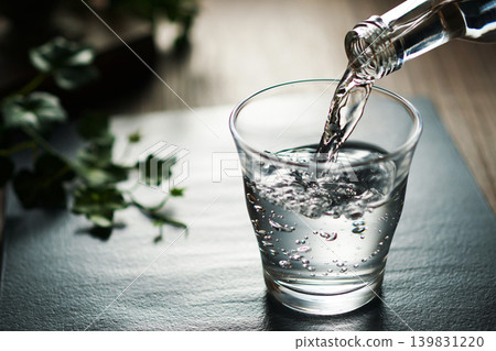 Mineral water being poured into a glass Mineral water being poured into a glass 139831220