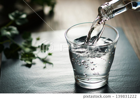 Mineral water being poured into a glass Mineral water being poured into a glass 139831222