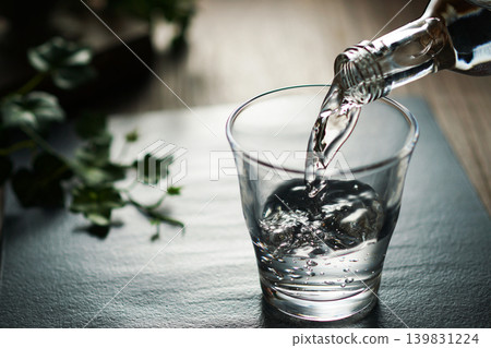 Mineral water being poured into a glass Mineral water being poured into a glass 139831224