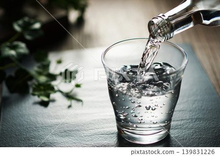 Mineral water being poured into a glass Mineral water being poured into a glass 139831226