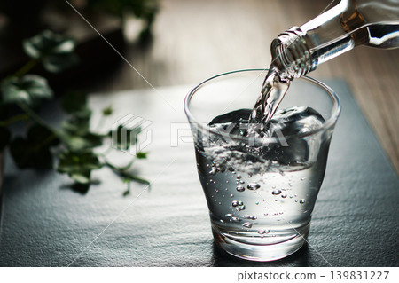 Mineral water being poured into a glass Mineral water being poured into a glass 139831227