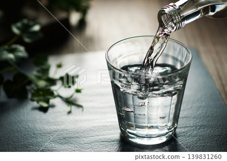 Mineral water being poured into a glass Mineral water being poured into a glass 139831260