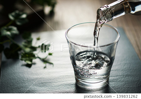 Mineral water being poured into a glass Mineral water being poured into a glass 139831262