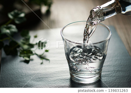 Mineral water being poured into a glass Mineral water being poured into a glass 139831263