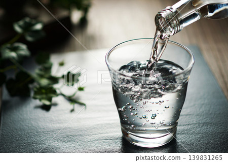 Mineral water being poured into a glass Mineral water being poured into a glass 139831265