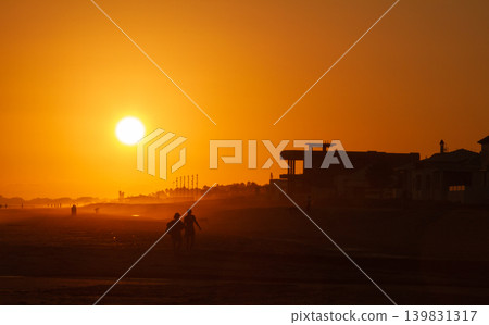 Orange Sahara dust sunset over Isla Cristina beach in Huelva Spain 139831317