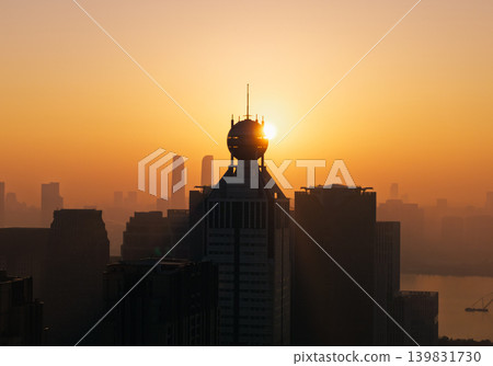 Sunrise over Hangzhou cityscape from above featuring skyscrapers and early morning light Sunrise over Hangzhou cityscape from above featuring skyscrapers and early morning light 139831730